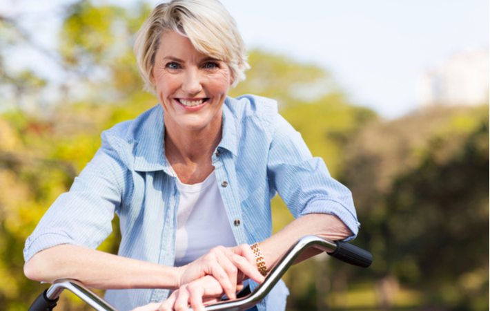 woman smiling on bike