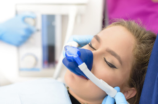 Relaxed woman undergoing a sedation dentistry procedure