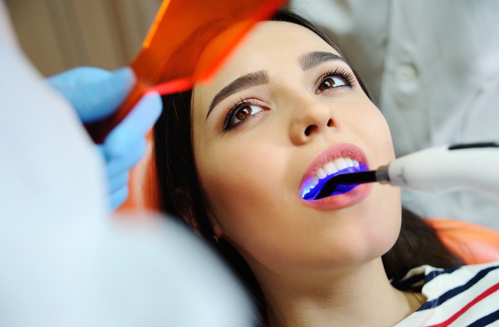 A young woman during her dental filling appointment